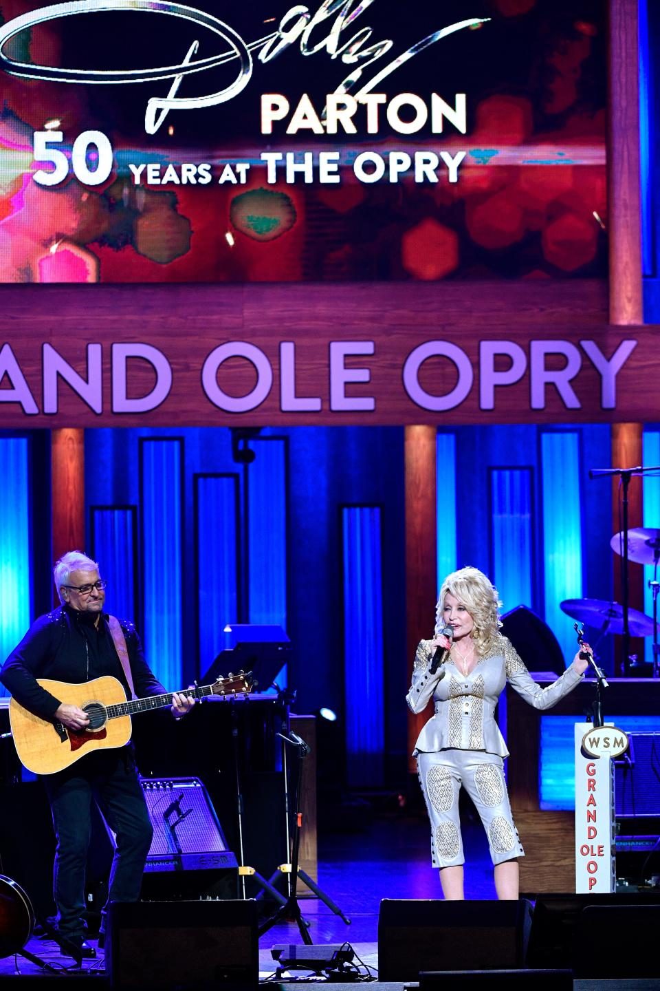 Dolly Parton performs at the 50th anniversary of her induction into the Grand Ole Opry in 2019.