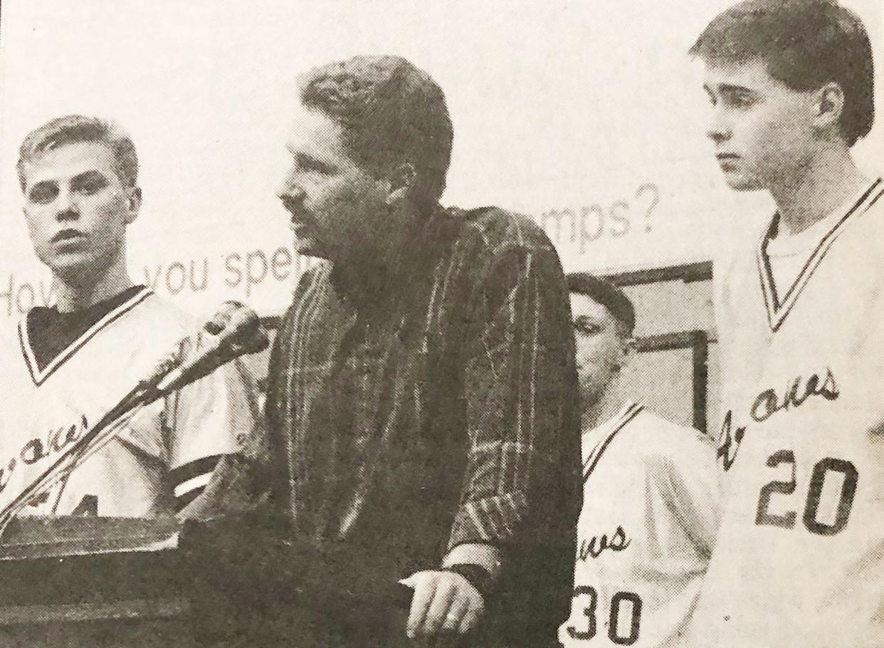 Watertown High School boys basketball coach Kraig Ulveling is flanked by seniors Brian Benson (left) and Shawn Liebl, speaks during a welcome-home celebration for the Arrows' 1992 state Class AA champions in the Civic Arena.