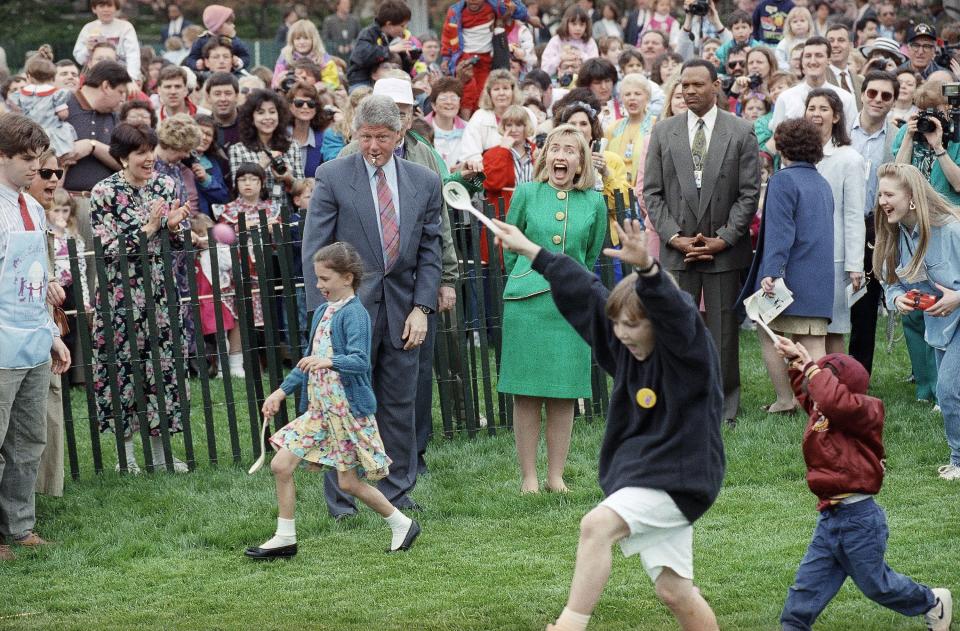 President Bill Clinton handles the starting whistling and first lady Hillary Rodham Clinton handles cheer leading chores during the annual Easter egg roll on the White House lawn in Washington, April 12, 1993. (AP Photo/Ron Edmonds) ORG XMIT: APHS341978 [Via MerlinFTP Drop]