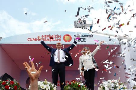 Muharrem Ince, presidential candidate of Turkey's main opposition Republican People's Party (CHP), and his wife Ulku, wave to supporters during an election rally in Istanbul, Turkey June 23, 2018. REUTERS/Osman Orsal