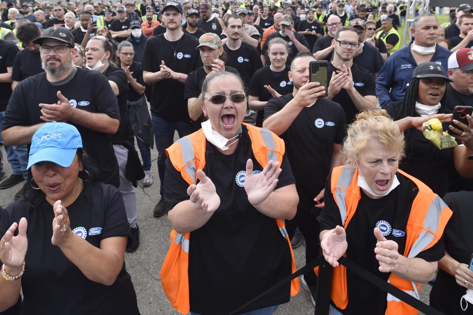 Workers of the Ford Motor Co. cheer during a news conference, Thursday, June 2, 2022, in Avon Lake, Ohio. Ford announced it will add 6,200 factory jobs in Michigan, Missouri and Ohio as it prepares to build more electric vehicles and roll out two redesigned combustion-engine models. (AP Photo/David Richard)