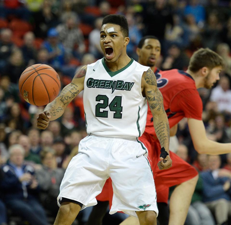 UWGB's Keifer Sykes reacts after a dunk at the Resch Center in Ashwaubenon.