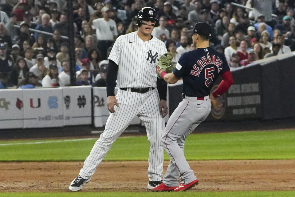New York Yankees' Anthony Rizzo gets picked off trying to steal third by Boston Red Sox shortstop Enrique Hernandez during the sixth inning of a baseball game, Sunday, June 11, 2023, in New York. (AP Photo/Bebeto Matthews)