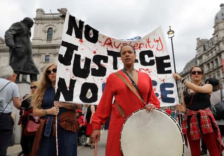 FILE PHOTO: Women gather in Parliament Square for a protest in support of legal abortion in Northern Ireland, and against a Tory coalition with the DUP, in central London, Britain, June 24, 2017. REUTERS/Marko Djurica/File Photo