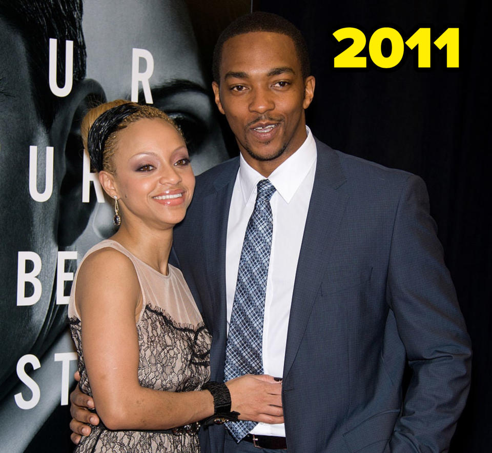 Anthony Mackie, wearing a suit and tie, poses with Sheletta Chapital, in a lace dress, at an event