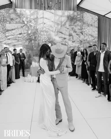 <p>Madison Emily Hare/BRIDES</p> Cole Swindell and Courtney Little Swindell dance at their Nashville wedding reception on June 22, 2024