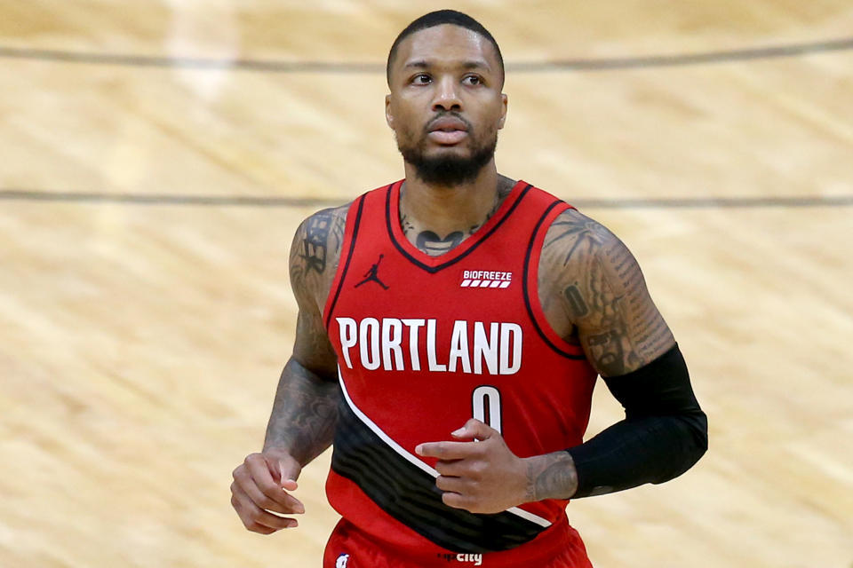 Damian Lillard #0 of the Portland Trail Blazers stands on the court during the fourth quarter of an NBA game against the New Orleans Pelicans.