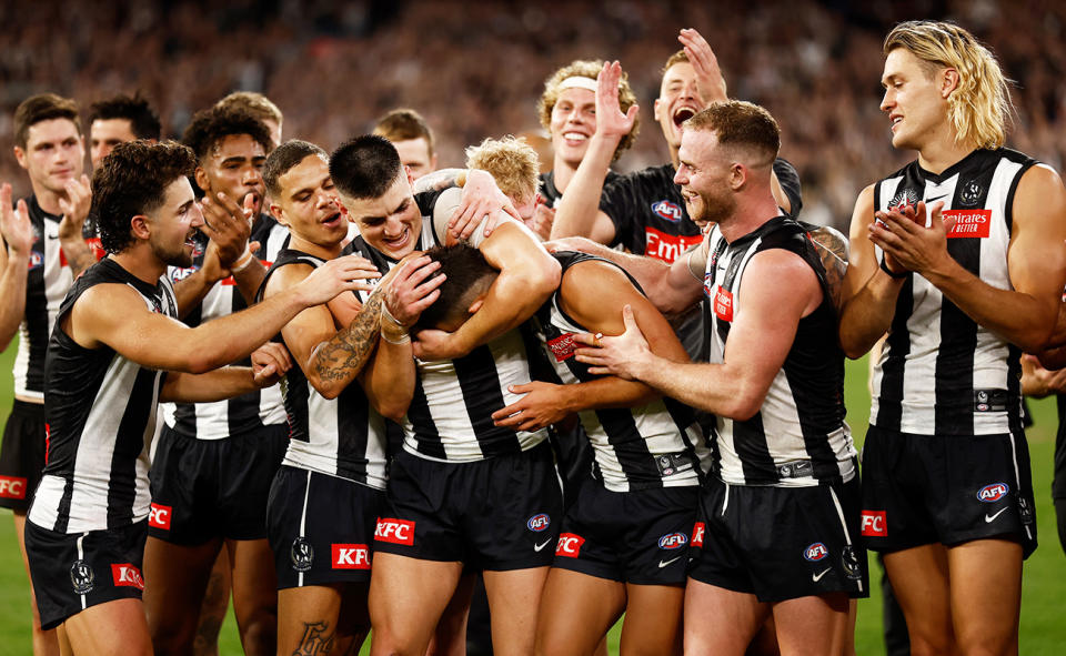 Nick Daicos, pictured here celebrating with Collingwood teammates after winning the Anzac Medal.