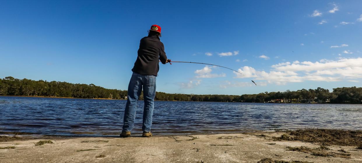 Seth O'Steen, 17, of Dunnellon, fishes for bass on Tiger Lake on Jan. 4, 2022.