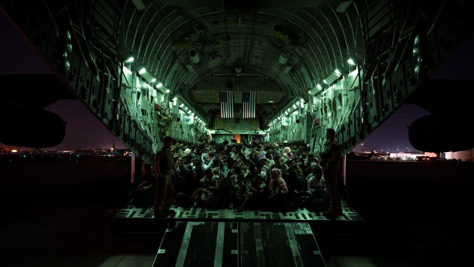 Evacuees aboard a US Air Force C-17 Globemaster III aircraft during the Afghanistan evacuation from Kabul on August 21, 2021. - Senior Airman Taylor Crul/U.S. Air Force/Reuters