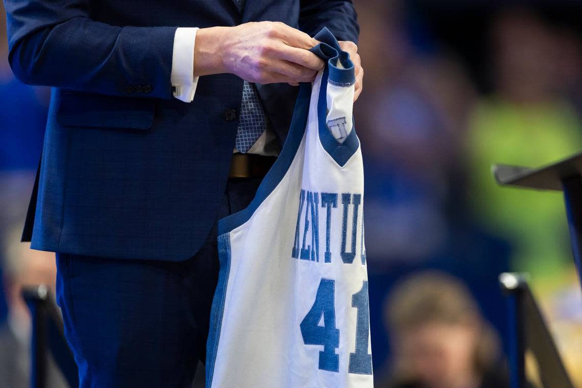 New Kentucky men’s basketball head coach Mark Pope held his former jersey from his time as a player for Kentucky during an introductory event at Rupp Arena Sunday.