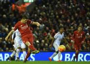 Liverpool's English midfielder James Milner scores the opening goal from the penalty spot during the English Premier League football match between Liverpool and Swansea City at the Anfield stadium in Liverpool, north-west England on November 29, 2015