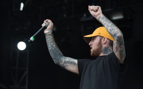 (FILES) In this file photo taken on June 03, 2016 Mac Miller performs at the Governors Ball Music Festival, in New York. - Mac Miller, the troubled rapper who won fans with his retro hip-hop but generated uncomfortable attention with songs on ex-girlfriend Ariana Grande and Donald Trump, died Friday September 7, 2018, at age 26, reports said. (Photo by Bryan R. Smith / AFP)BRYAN R. SMITH/AFP/Getty Images - Credit: BRYAN R. SMITH/ AFP