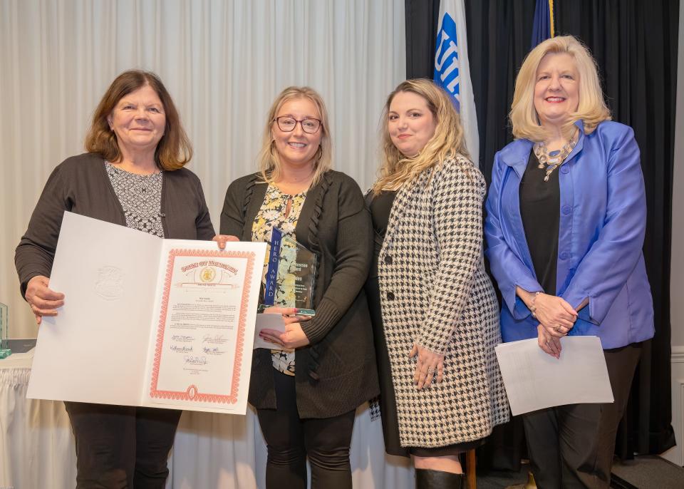 Kim Canales, second from left, was named the Animal Rescue Hero at the 21st annual Everyday Heroes Event on March 29.