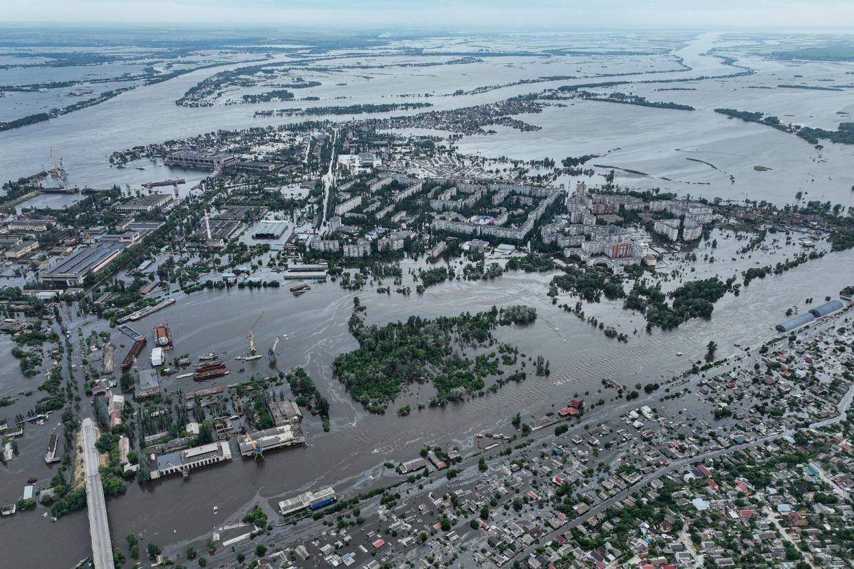 Houses are seen underwater and polluted by oil in a flooded neighbourhood in Kherson after the destrucion of the Kakhovka dam (Copyright 2020 The Associated Press. All rights reserved)