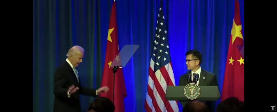 A screengrab with Vice President Joe Biden and U.S. Ambassador to China Gary Locke from the Trump campaign's advertisement.