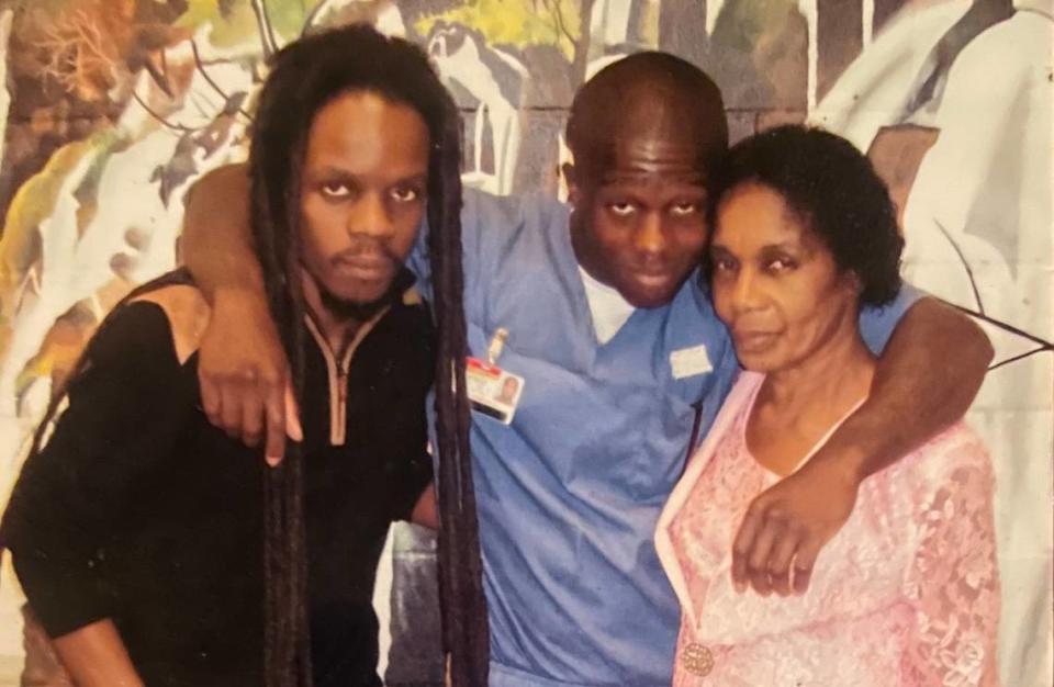 Emmanuel Jean, 26, poses for a photo in 2013 with his brother Nahum Jean, left, and his mother Yolette Jean, right, during a visit at the Hamilton Correctional Institution in Jasper, Florida. Jean was released from prison 16 years after being wrongfully accused.