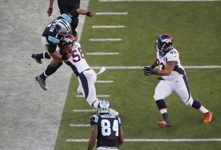 Carolina Panthers' quarterback Cam Newton (1) is knocked out of bounds by Denver Broncos' Von Miller (58) during the second quarter of the NFL's Super Bowl 50 football game in Santa Clara, California February 7, 2016. REUTERS/Michael Fiala