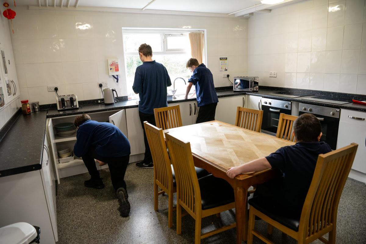Cloughwood Academy students tidying a kitchen <i>(Image: Kaleidoscope Learning Trust)</i>