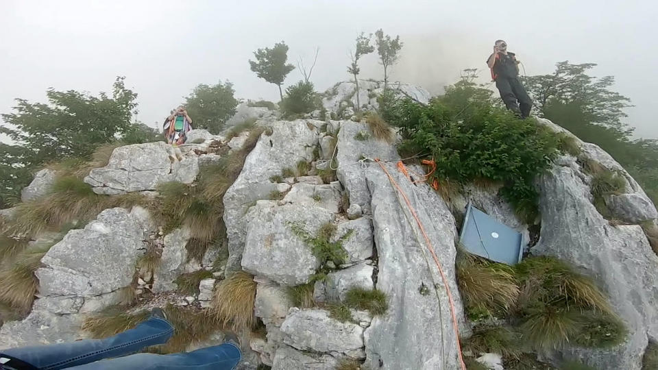 These friends filmed themselves freefalling backwards from a cliff - while holding hands. Josephine Eve, 28, and Niclas Strohmeier, 23, performed the stunt at the BASE jumping hotspot of Monte Brento, Italy. They fall backwards into the dense mist below before separating in the air and landing safely.