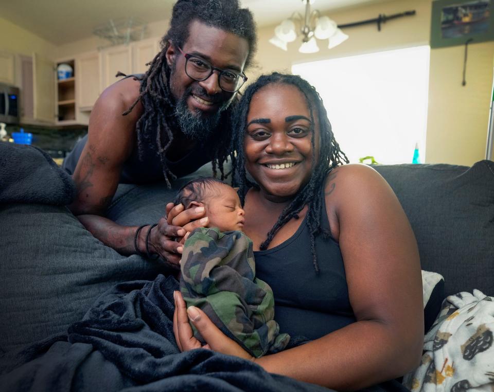 Anthony and Isis Davis with their newborn son, Akovi, at their Palm Coast home, Monday, July 2, 2023.