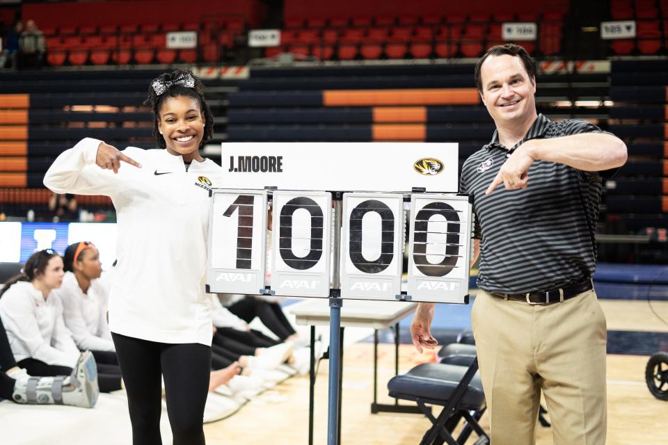 Missouri gymnast Jocelyn Moore, left, and MU coach Shannon Welker celebrate after Moore's perfect score on the floor on March 17, 2024, in Champaign, Illinois.