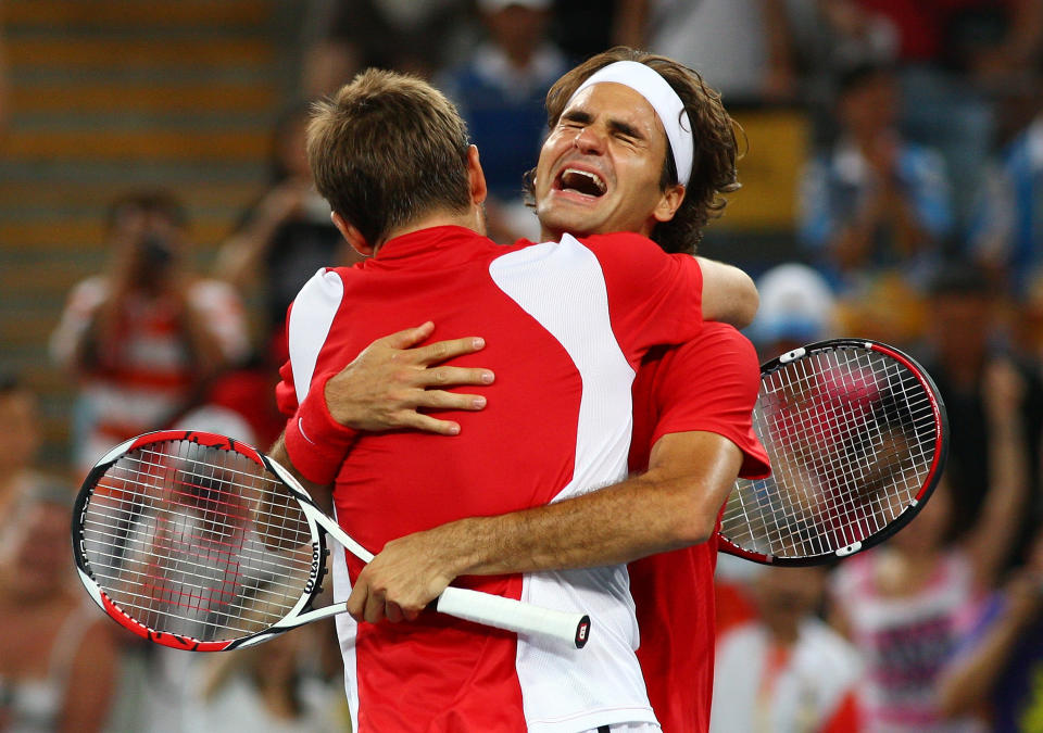 BEIJING - AUGUST 16: Roger Federer (right) and Stanislas Wawrinka of Switzerland celebrate after defeating Thomas Johansson and Simon Aspelin of Sweden during the men's doubles gold medal tennis match at the Olympic Green Tennis Center on Day 8 of the Beijing 2008 Olympic Games on August 16, 2008 in Beijing, China. (Photo by Clive Brunskill/Getty Images)