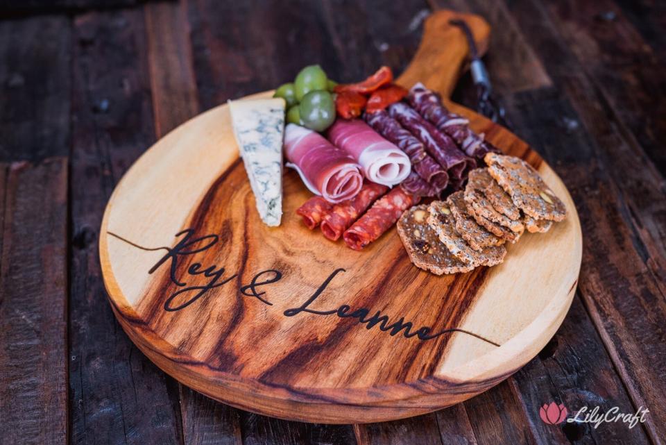 There's nothing cheesy about this gorgeous, custom engraved cheese or charcuterie platter.&nbsp;<strong><a href="https://www.etsy.com/listing/735721282/personalised-cheese-board-custom?ga_order=most_relevant&amp;ga_search_type=all&amp;ga_view_type=gallery&amp;ga_search_query=personalized+cheese+board&amp;ref=sr_gallery-1-21&amp;organic_search_click=1&amp;pro=1" target="_blank" rel="noopener noreferrer">Get this engraved charcuterie platter for&nbsp;$59.56</a>.</strong>