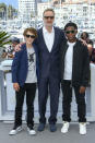 Michael Banks Repeta, from left, James Gray, and Jaylin Webb pose for photographers at the photo call for the film 'Armageddon Time' at the 75th international film festival, Cannes, southern France, Friday, May 20, 2022. (Photo by Joel C Ryan/Invision/AP)