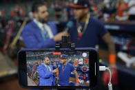 Houston Astros center fielder Jose Siri is interviewed during batting practice before Game 2 of baseball's World Series between the Houston Astros and the Atlanta Braves Wednesday, Oct. 27, 2021, in Houston. (AP Photo/David J. Phillip)