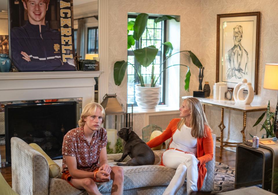 Anne Vanker, of Grosse Pointe, sits with her son Thaddeus MacKrell, left, as they talk about the loss their 18-year-old family member Flynn MacKrell, who was killed in a car crash last fall after his friend crashed into a lamp post at 105 mph. Her family wants the mother of the driver charged with involuntary manslaughter, alleging she knew for months her son was driving at speeds of over 140 mph, texting him to slow down yet never took his keys away. Rather, she gave him access to her BMW race car, which he was driving when he killed his college friend last fall.