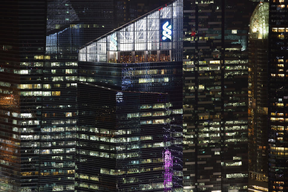 Standard Chartered is giving up nine of the floors it leases at Marina Bay Financial Tower 1. (PHOTO: Suhaimi Abdullah/Getty Images) - DECEMBER 31:  The Standard Chartered Building is seen at the Marina Bay Financial Centre on December 31, 2014 in Singapore. Singapore is set to celebrate her 50th anniversary of independence in 2015 with a year long activity with theme for all Singaporeans to celebrate as one people.  (Photo by Suhaimi Abdullah/Getty Images)