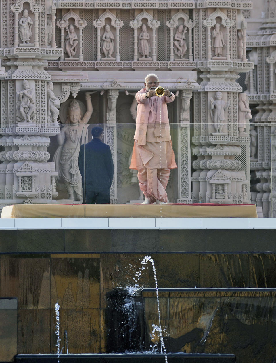 Indian Prime Minister Narendra Modi conducts a Hindu ritual as he inaugurates the first stone-built Hindu temple in the Middle East, belonging to Bochasanwasi Akshar Purushottam Swaminarayan Sanstha in Abu Mureikha, 40 kilometers (25 miles) northeast of Abu Dhabi, United Arab Emirates, Wednesday, Feb. 14, 2024. (AP Photo/Kamran Jebreili)