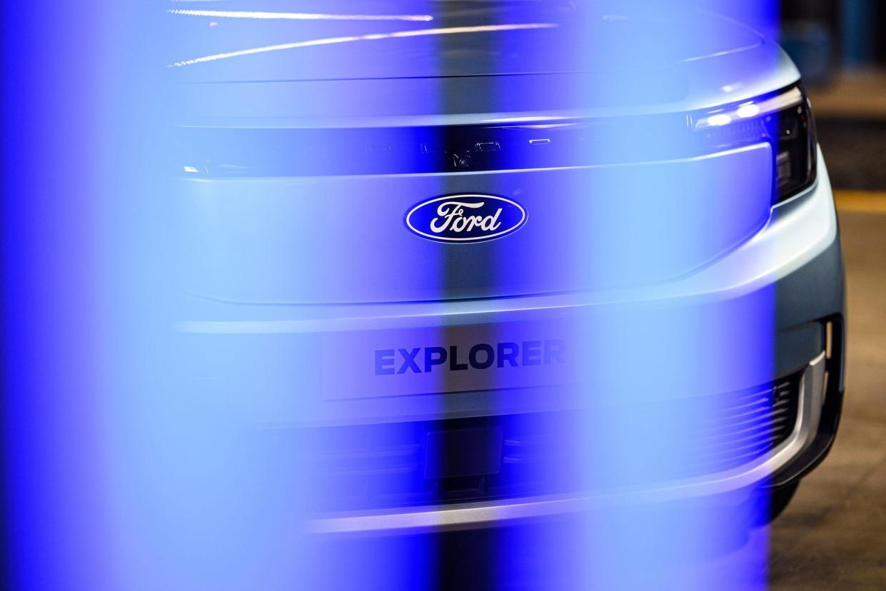 A Ford logo on the front of an Explorer.