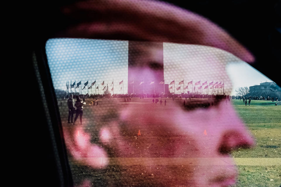 Activists and faith groups are pictured through a sticker of former President Donald Trump as they protest against COVID-19 vaccine mandates and restrictions put in place across the nation at the "Defeat the Mandates American Homecoming" rally in Washington, on Jan. 23.<span class="copyright">Shuran Huang for The Washington Post</span>