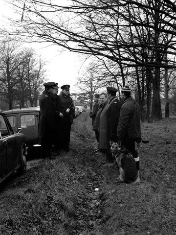 <p>Mirrorpix via Getty</p> Police at a press conference before searching Wimbledon Common for Muriel McKay's whereabouts, December 1969.