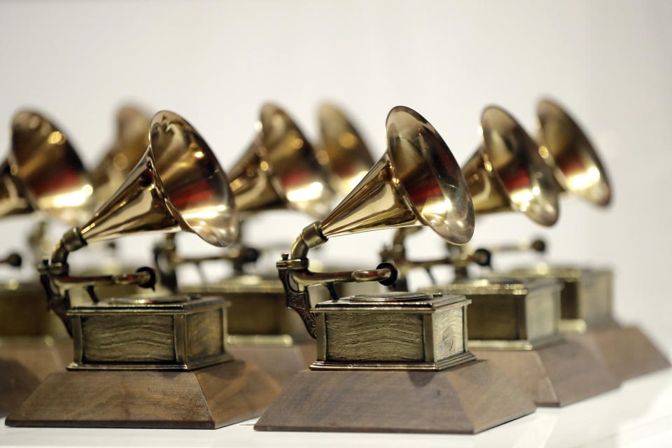 FILE - In this Oct. 10, 2017, file photo, various Grammy Awards are displayed at the Grammy Museum Experience at Prudential Center in Newark, N.J. The Grammys is sticking to its word with the public release of the full inclusion rider to ensure equity and inclusion on all levels of production for next year’s ceremony. The Recording Academy released on Tuesday, Oct. 19, 2021, an eight-page document detailing the rider’s purposes and objectives. The agreement will require producers to recruit and hire more diverse candidates backstage and in front of the camera for the 64th annual awards ceremony on Jan. 31. (AP Photo/Julio Cortez, File)