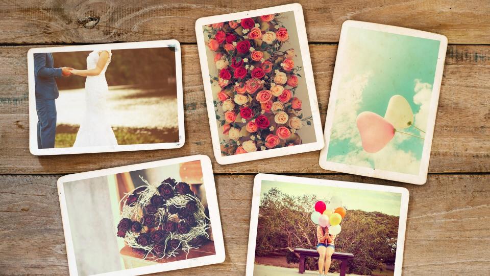 Instant photo album of remembrance and nostalgia in wedding and honeymoon on wood table.