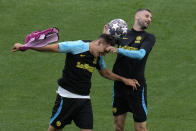 Inter Milan's Lautaro Martinez, left, and Inter Milan's Marcelo Brozovic battle for the ball during a training session at the Ataturk Olympic Stadium in Istanbul, Turkey, Friday, June 9, 2023. Manchester City and Inter Milan are making their final preparations ahead of their clash in the Champions League final on Saturday night. (AP Photo/Thanassis Stavrakis)