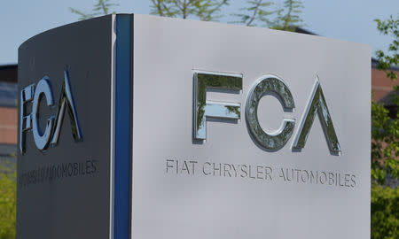 FILE PHOTO: A Fiat Chrysler Automobiles (FCA) sign is seen at the U.S. headquarters in Auburn Hills, Michigan, U.S. May 25, 2018. REUTERS/Rebecca Cook/File Photo