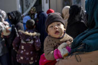 A mother with her malnourished child waits to receive help and check-up at a clinic that run by the WFP, in Kabul, Afghanistan, Thursday, Jan. 26, 2023. A spokesman for the U.N. food agency says malnutrition rates in Afghanistan are at record highs. Aid agencies have been providing food, education, healthcare and other critical support to people, but distribution has been severely impacted by a Taliban edict banning women from working at national and international nongovernmental groups. (AP Photo/Ebrahim Noroozi)