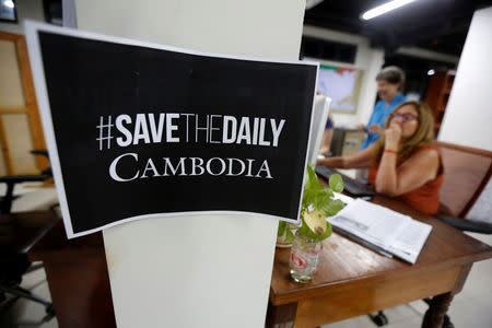 Journalists work at the newsroom of The Cambodia Daily newspaper in Phnom Penh, Cambodia, September 3, 2017. REUTERS/Samrang Pring