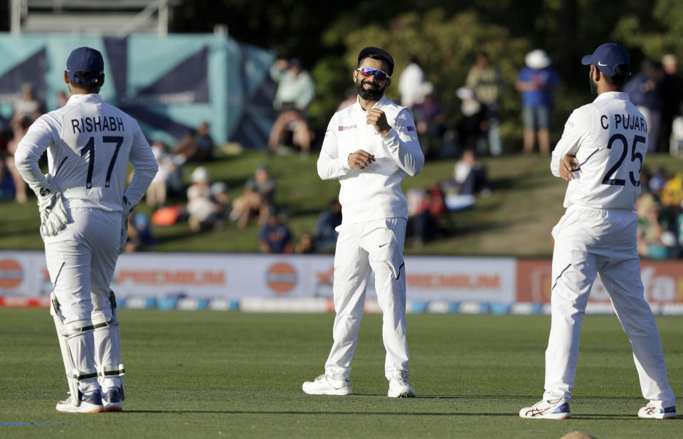 India's Virat Kohli, centre, reacts during play on day one of the second cricket test between New Zealand and India at Hagley Oval in Christchurch, New Zealand, Saturday, Feb. 29, 2020. (AP Photo/Mark Baker)