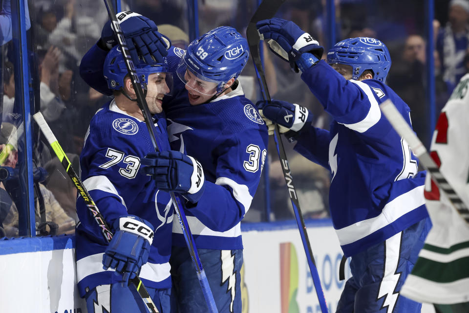 Tampa Bay Lightning's Waltteri Merela (39) celebrates his first NHL goal with Conor Sheary, left, and Tyler Motte, during the second period of the team's NHL hockey game against the Minnesota Wild on Thursday, Jan. 18, 2024, in Tampa, Fla. (AP Photo/Mike Carlson)