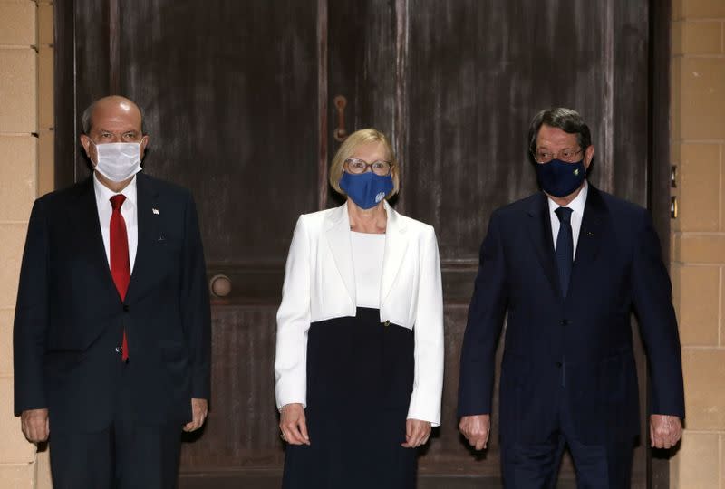 Elizabeth Spehar, U.N. Special Representative of the Secretary-General and Head of UNFICYP Mission poses with Cypriot President Nicos Anastasiades and Turkish Cypriot leader Ersin Tatar in the buffer zone of Nicosia airport