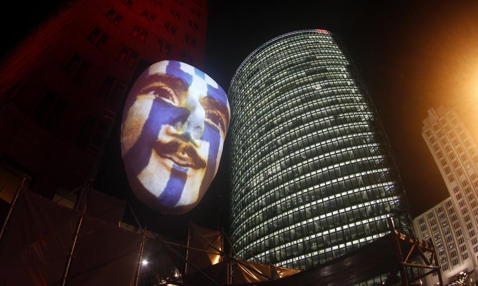 An illuminated face sculpture is pictured during a rehearsal for the upcoming festival of lights in Berlin
