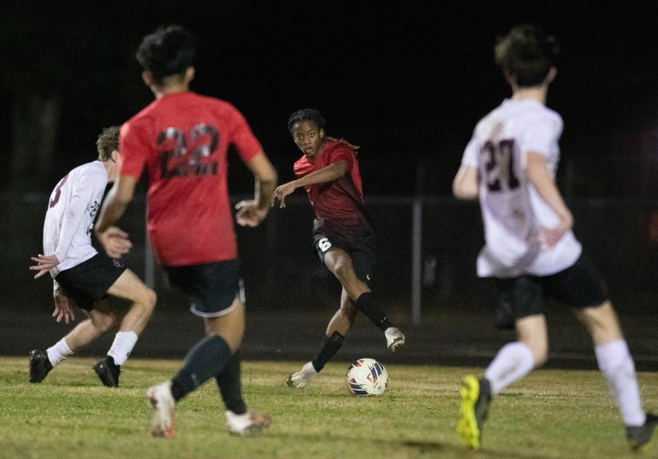 Tyrin Joiner (6) passes the ball during the Pensacola vs West Florida boys soccer game at West Florida High School in Pensacola on Thursday, Jan. 25, 2024.