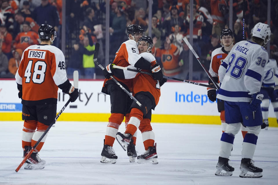 Philadelphia Flyers' Bobby Brink, right, and Egor Zamula celebrate after Brink's goal during the first period of an NHL hockey game, Tuesday, Feb. 27, 2024, in Philadelphia. (AP Photo/Matt Slocum)