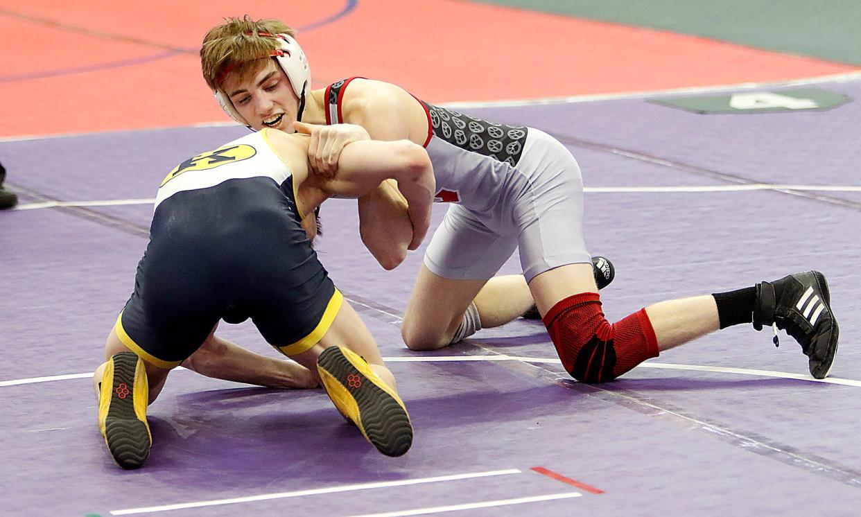 Crestview's Hayden Kuhn wrestles Kirtland's Will Davidson during their match Friday, March 11, 2022 at the OHSAA State Wrestling Championship at the Jerome Schottenstein Center in Columbus. TOM E. PUSKAR/TIMES-GAZETTE.COM