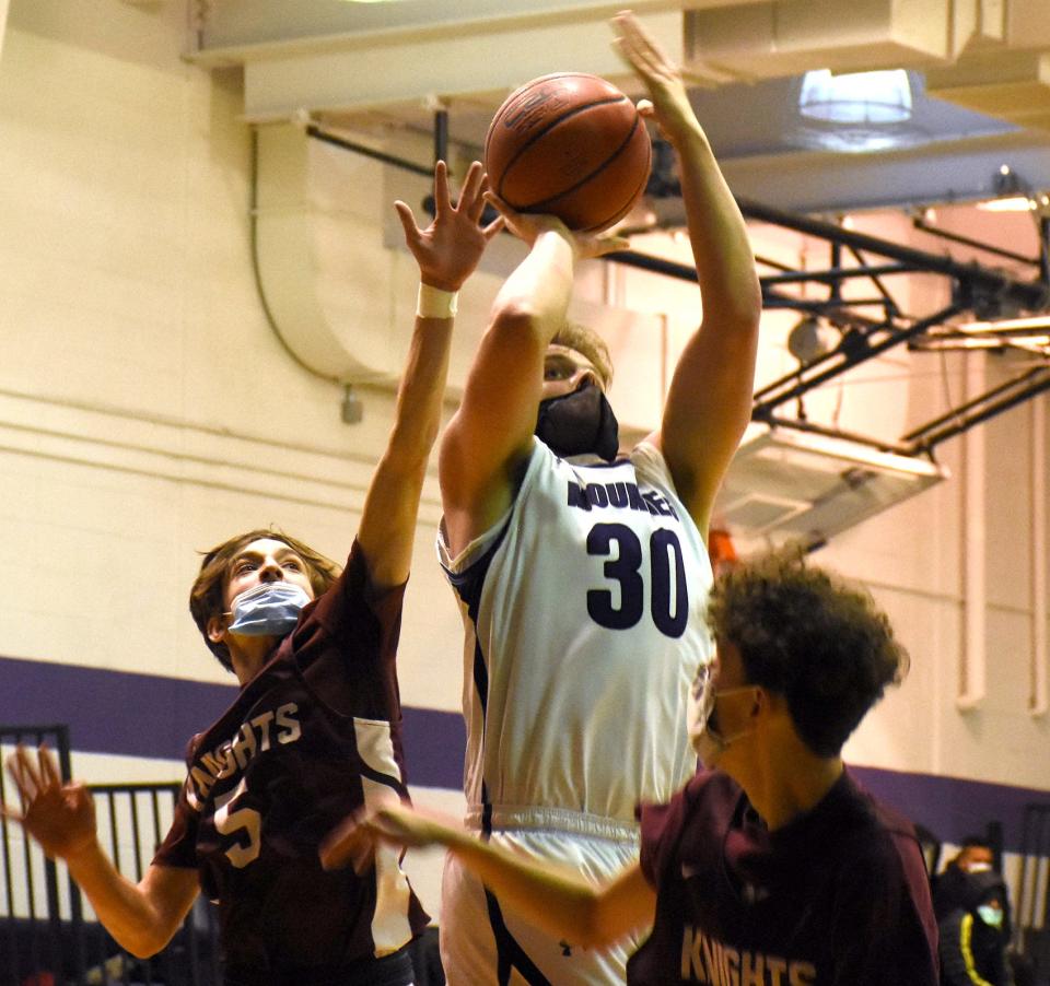 Tanner Jaquay (30) attempts a shot for Little Falls between Frankfort-Schuyler defenders Friday during a first round game at the Little Falls Holiday Classic.